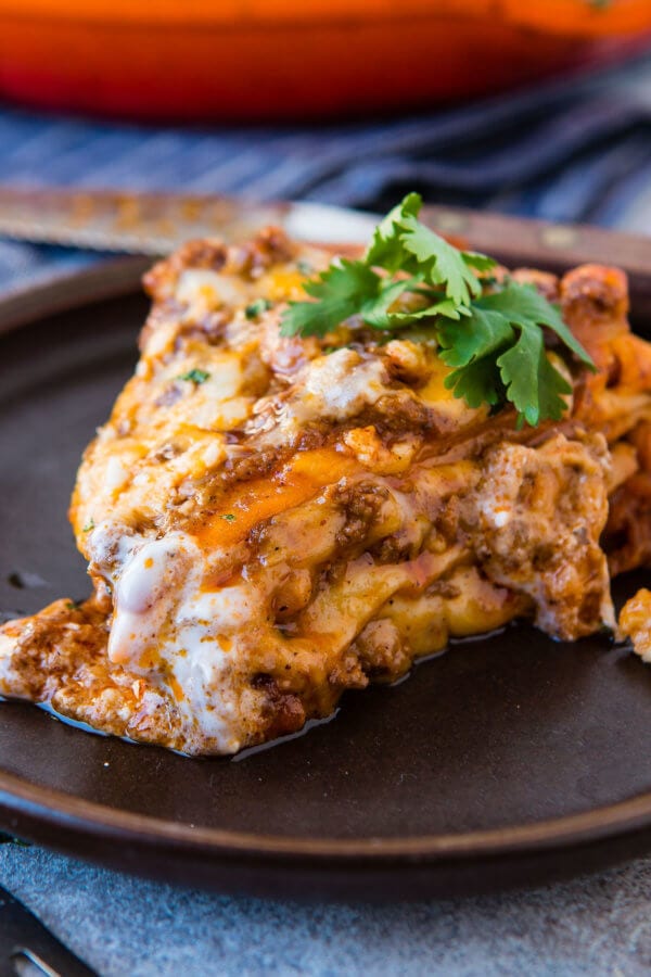 This is so good!!! One skillet enchilada casserole is loaded with saucy ground beef, gooey cheese and lots of flavor! It's our family's new favorite easy dinner recipe! ohsweetbasil.com This is so good!!! One skillet enchilada casserole is loaded with saucy ground beef, gooey cheese and lots of flavor! It's our family's new favorite easy dinner recipe! ohsweetbasil.com
