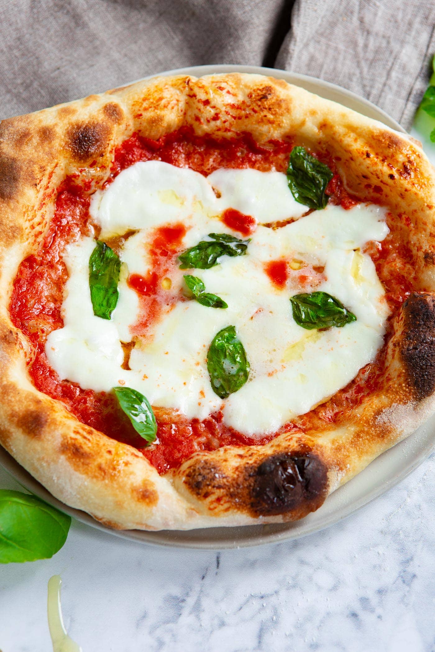 homemade margherita pizza with fresh basil leaves homemade margherita pizza with fresh basil leaves