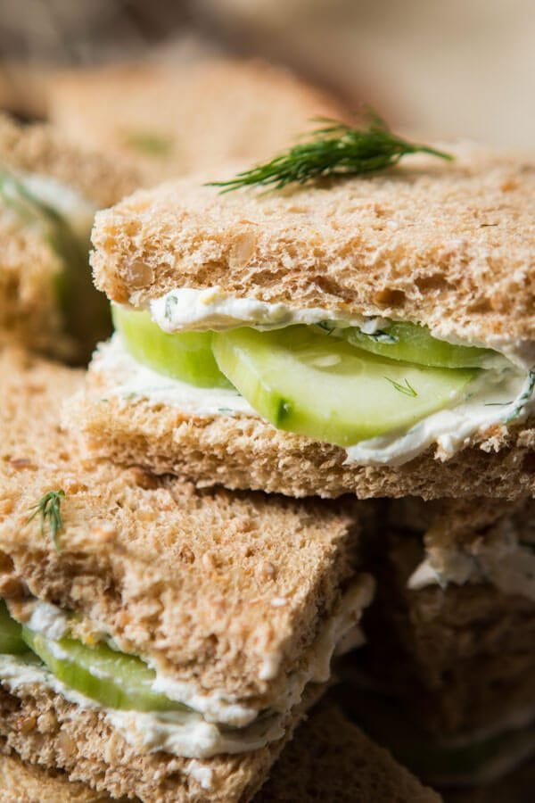 The best lemon dill cucumber sandwiches I've ever had added a touch of Greek yogurt to the spread. Try this awesome tea sandwich recipe at your next party! ohsweetbasil.com The best lemon dill cucumber sandwiches I've ever had added a touch of Greek yogurt to the spread. Try this awesome tea sandwich recipe at your next party! ohsweetbasil.com
