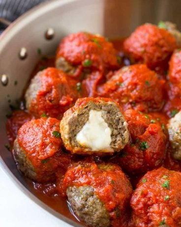These tender meatballs are stuffed with melty mozzarella cheese - serve as an appetizer or over a big plate of spaghetti! These tender meatballs are stuffed with melty mozzarella cheese - serve as an appetizer or over a big plate of spaghetti!