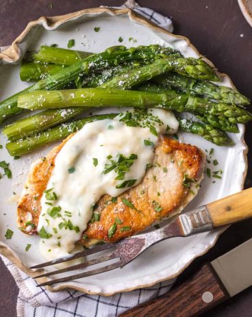 These Creamy Parmesan Pork Chops are sure to be a hit around the family table. The simple garlic parmesan sauce is oh so delicious and so easy anyone can make it in minutes. These Creamy Parmesan Pork Chops are sure to be a hit around the family table. The simple garlic parmesan sauce is oh so delicious and so easy anyone can make it in minutes.
