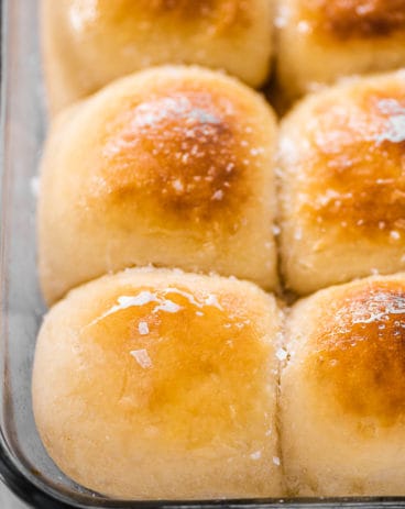 A close up of potato rolls in a pan. A close up of potato rolls in a pan.
